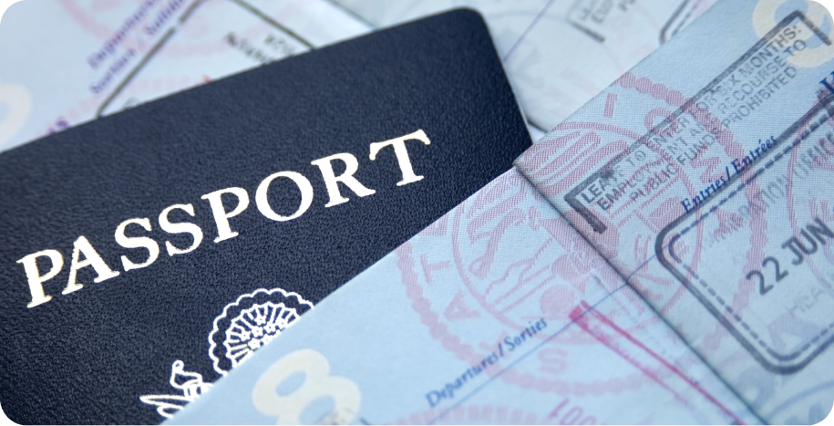 A passport and some money on top of a table.